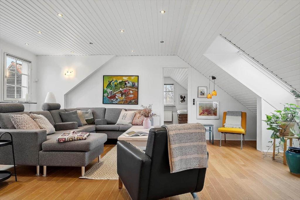 a living room with a couch and a table at 20427-Samso-Torup-13 in Torup