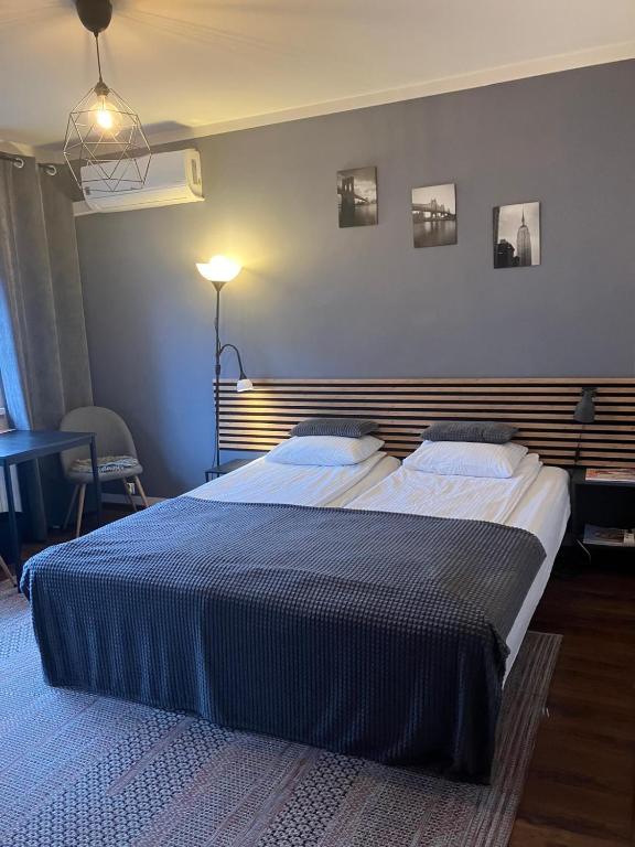 a bedroom with two beds in a room at Szybowników 2 in Piła