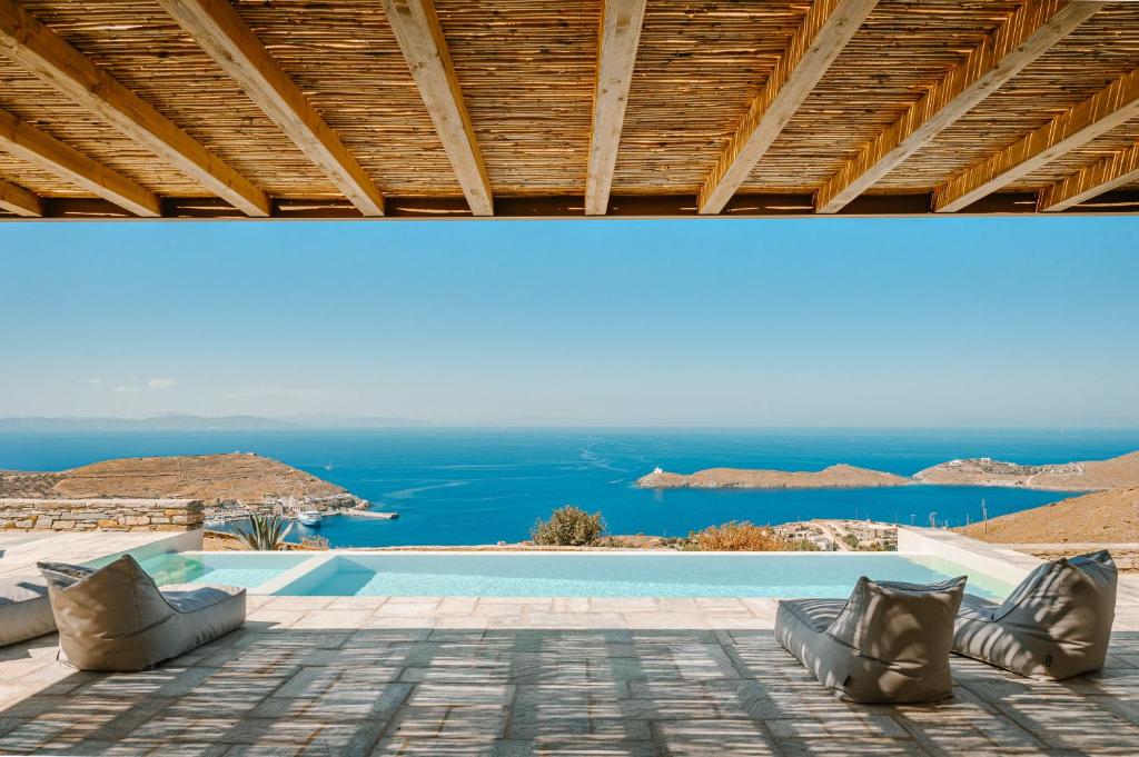 a view of a swimming pool from a villa at Sunset Heaven Villa on Kea in Korissia