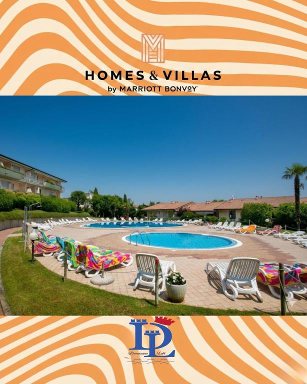 a sign for a hotel with chairs and a swimming pool at A casa di Attila DesenzanoLoft Official Partner Homes & Villas by Marriott Bonvoy in Desenzano del Garda