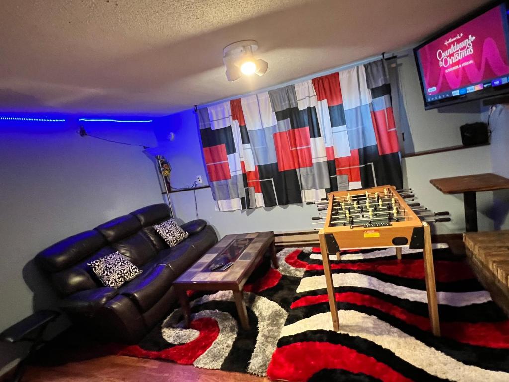 a living room with a couch and a table at MidwestBNB Room1, quite cabin in the wood vibes in Minneapolis