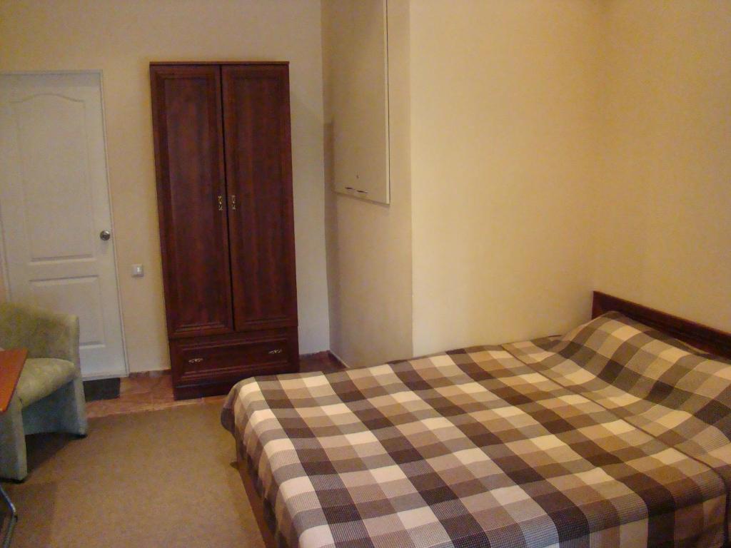 Postel nebo postele na pokoji v ubytování Mini-hotel in Odessa Yard