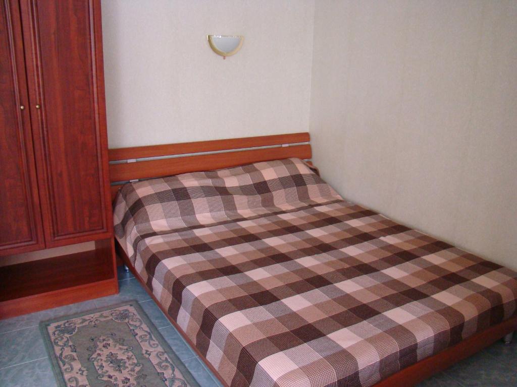 Postel nebo postele na pokoji v ubytování Mini-hotel in Odessa Yard