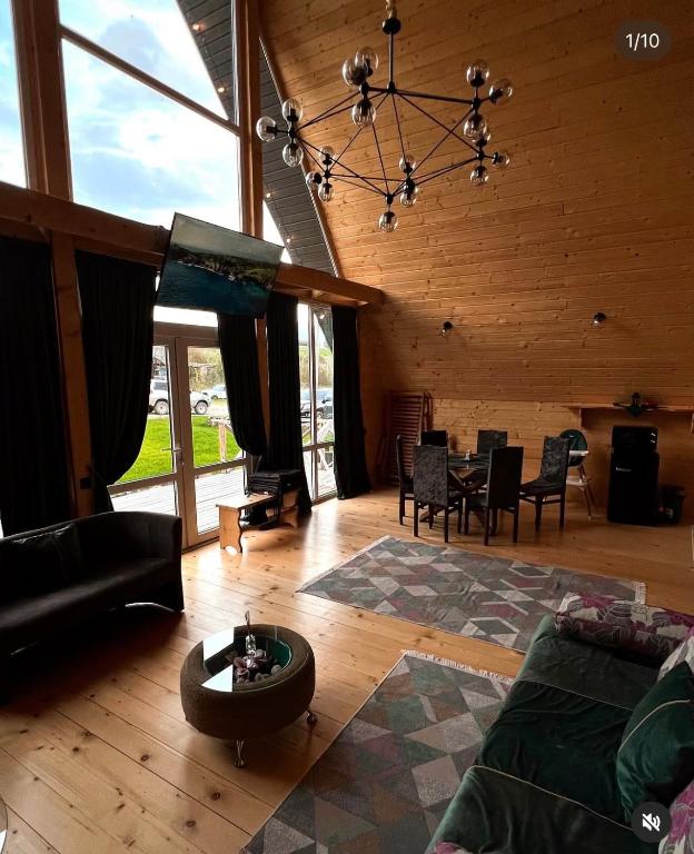 a living room with a couch and a table at Aframe in Skhidnitsa