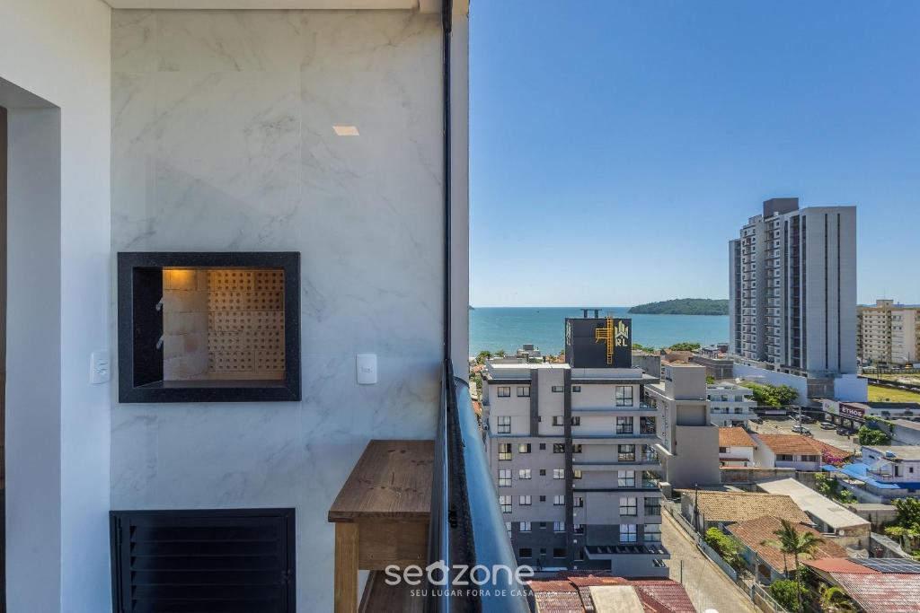 a view of the city from the balcony of a building at Apt w/ BBQ and Partial Ocean View ALE0803 in Piçarras