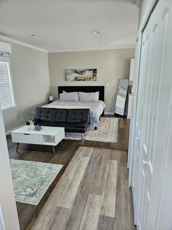 a bedroom with a bed and a couch and a table at Apartment in Cleveland in Cleveland