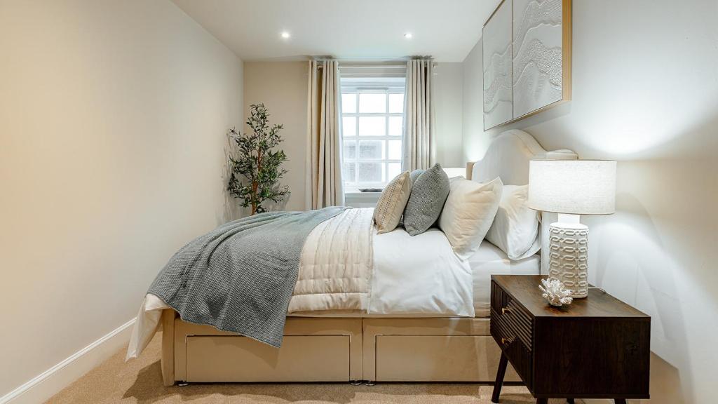 a bedroom with a bed and a window at Creel Cottage, Lower Largo in Lower Largo