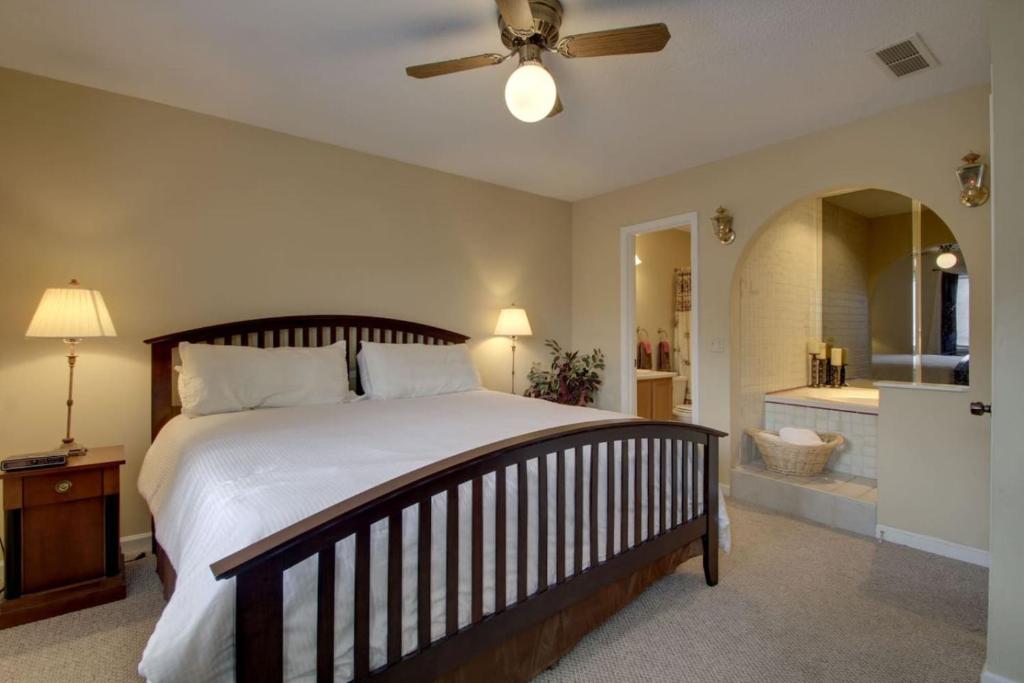 a bedroom with a large bed and a bathroom at Rivers Edge Condo 902 in Helen