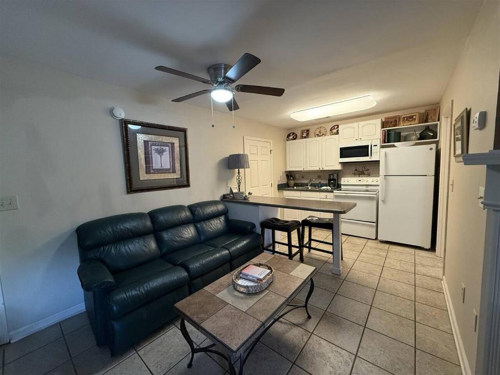 a living room with a couch and a table at Rivers Edge 803 in Helen