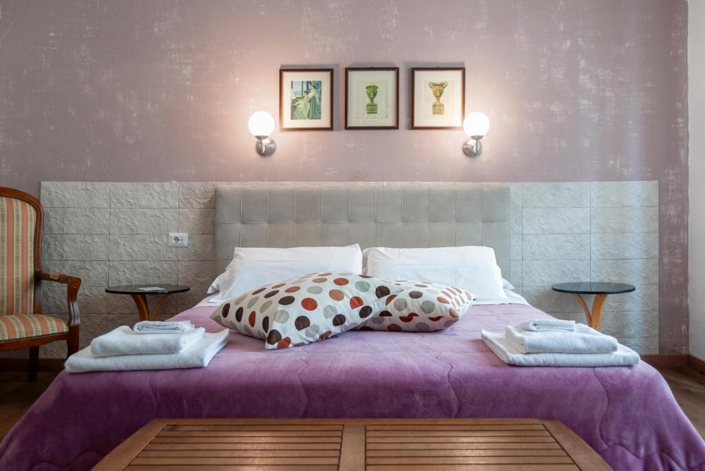 Llit o llits en una habitació de Aedes B&B Il Giardino dei Sogni