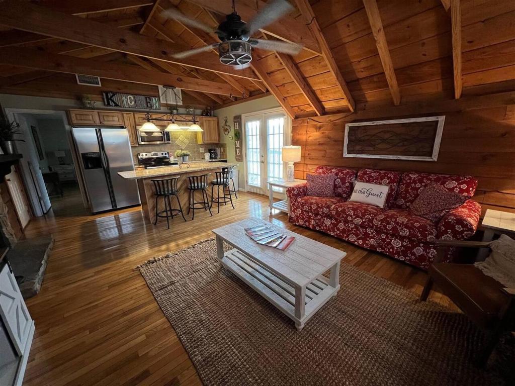 a living room with a couch and a table at Bavarian Brook Condo 12 in Helen