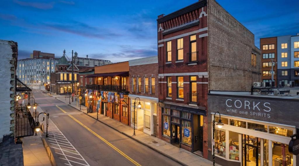 a city street at night with buildings and street lights at Old City Loft Knoxville in Knoxville