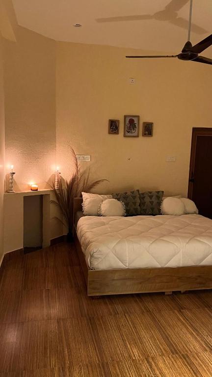 a bedroom with a large bed in a room at Yugm Homes Rishikesh in Narendranagar