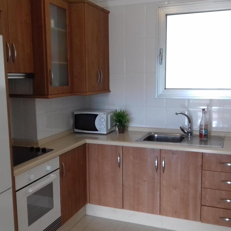 A kitchen or kitchenette at Apartamento Sunset