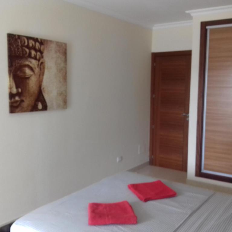 A bed or beds in a room at Apartamento Sunset