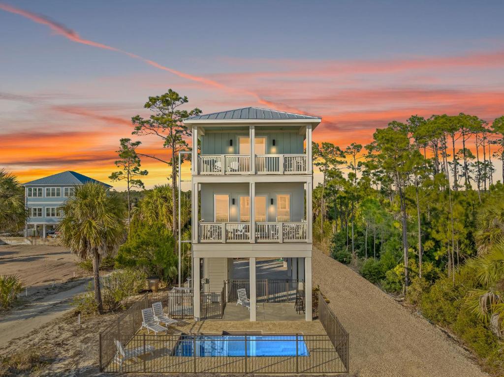 an aerial view of a house with a pool at Pet Friendly Beach House with Private Pool - Bella View in Port Saint Joe