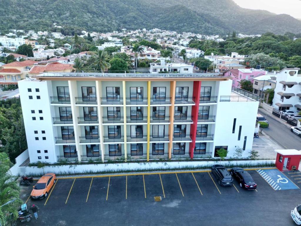 an aerial view of a building with a parking lot at PF Hotel in San Felipe de Puerto Plata
