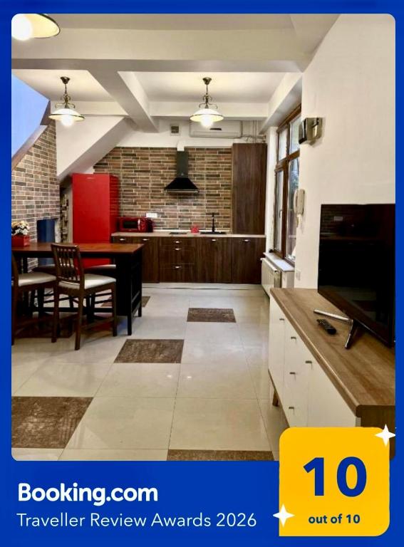 a living room with a kitchen and a dining room at Marsali Vila in Constanţa