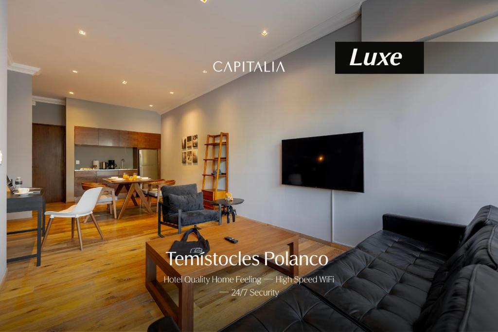 a living room with a couch and a table at Capitalia Temistocles Polanco in Mexico City