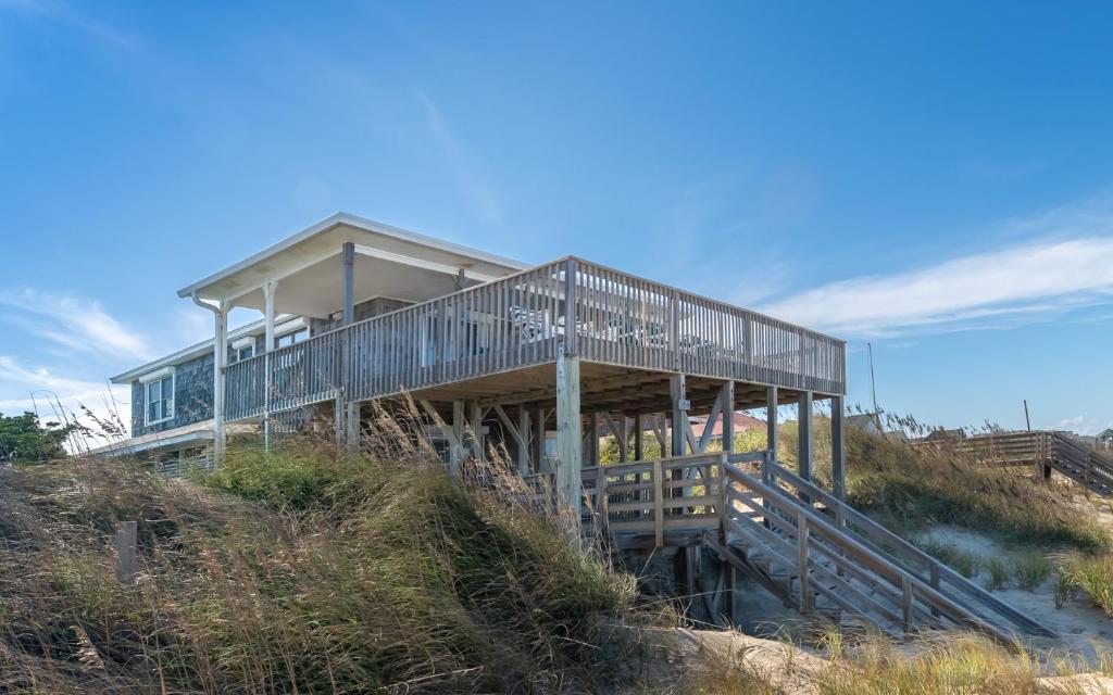 a house on the top of a hill at Jacks - Nags Head MP 12, Oceanfront, Ocean Views, Huge Deck, YMCA Pkg in Nags Head