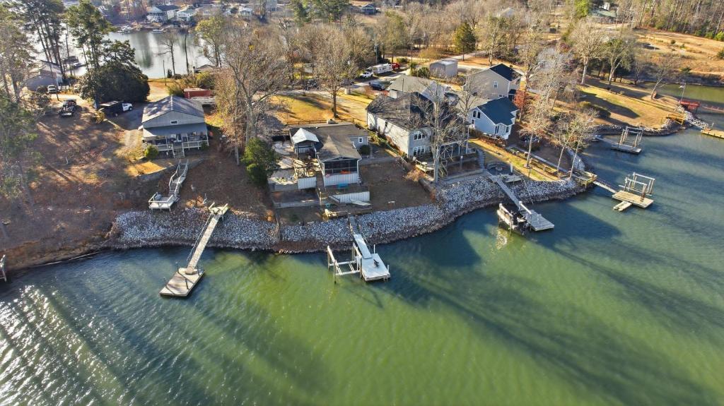 an aerial view of a house with a dock in the water at Deep Water Stays on Lake Murray in Lake Murray Shores