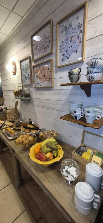 a table with a bunch of food on it at Aux Genêts D'Or in Trévé