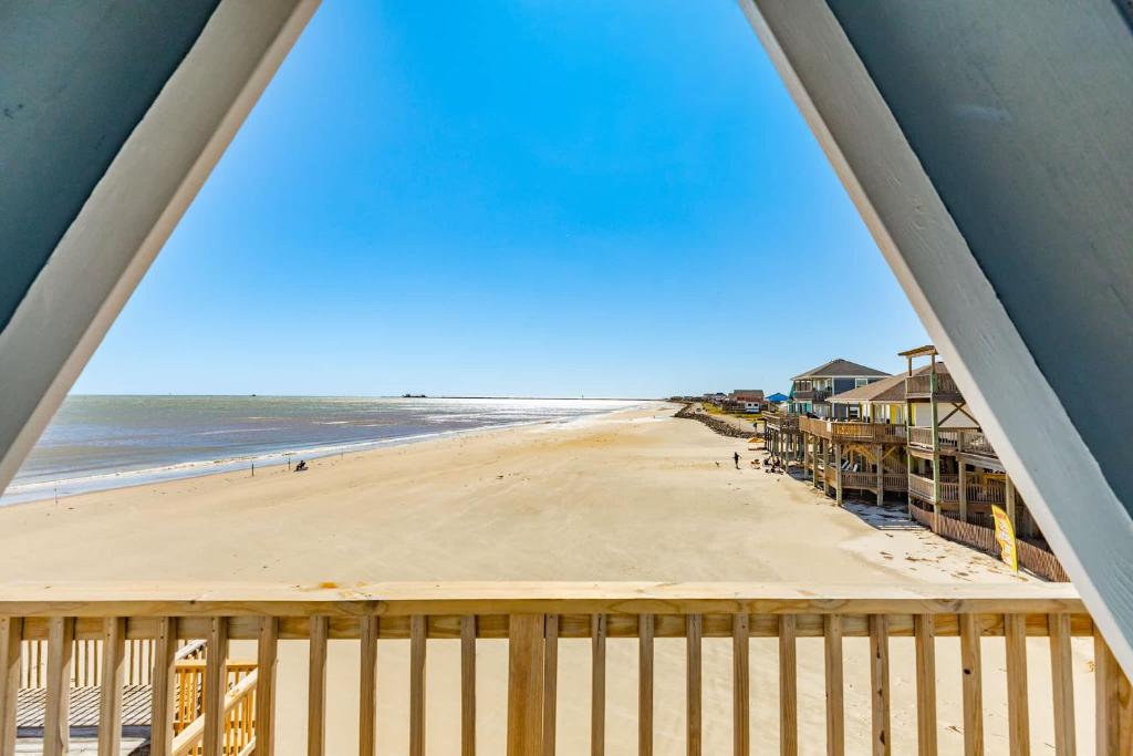 a view of the beach from the balcony of a beach house at Come Enjoy the Best Beach View in Surfside in Surfside Beach