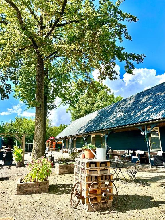 a house with a bike parked in front of it at Gasterij Hotel Dennenoord in Boxtel