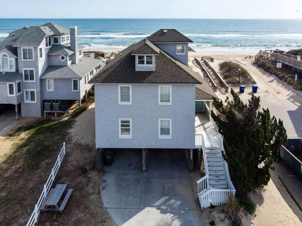 an aerial view of a house on the beach at Sea Reunion - Nags Head MP 12.5, Oceanfront, Amazing Views! Pool, Hot Tub, Pets OK in Nags Head