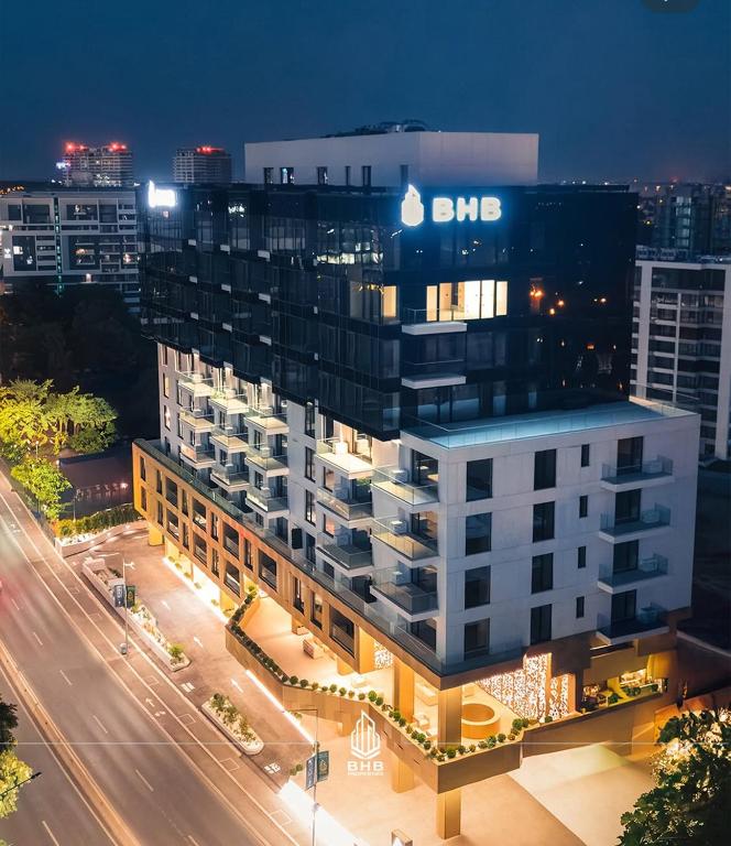 a building with an sbs sign on top of it at PREMIUM Apartament & Wellness with jacuzzi, sauna , gym , pool in Bucharest