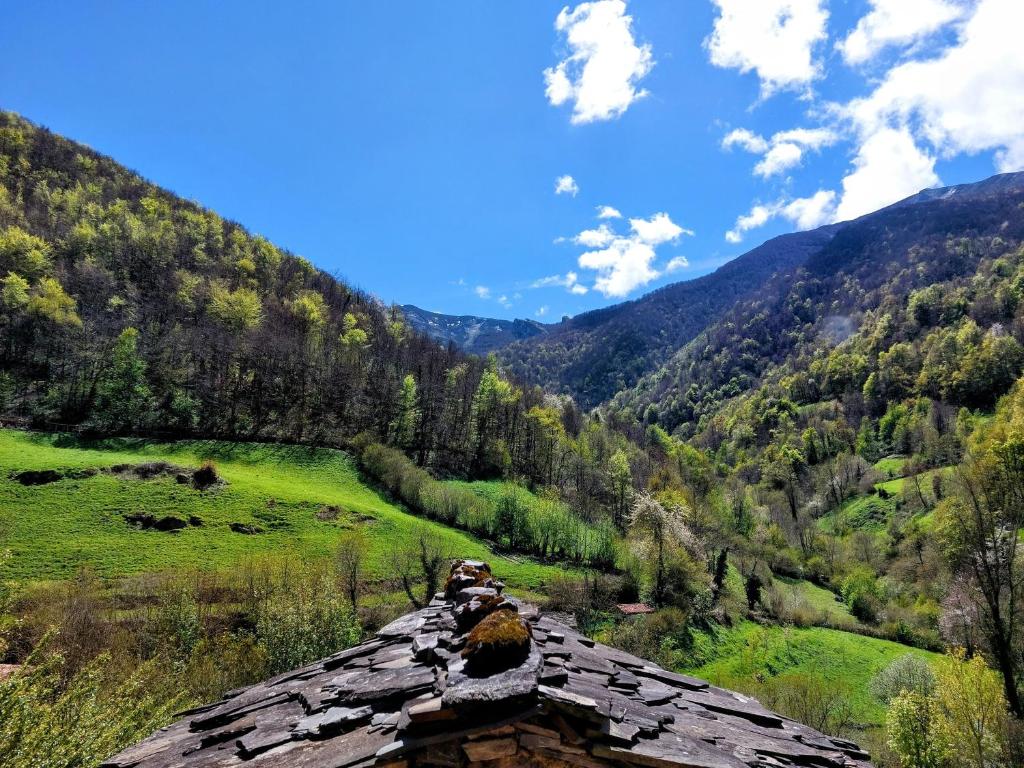 a view from the roof of a house in the mountains at Casa Nayala in Río Aller