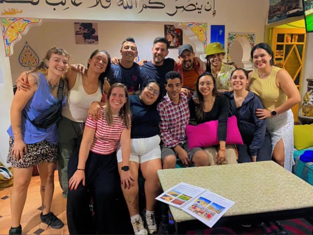 a group of people posing for a picture in a room at Hostel kif kif annex in Marrakesh