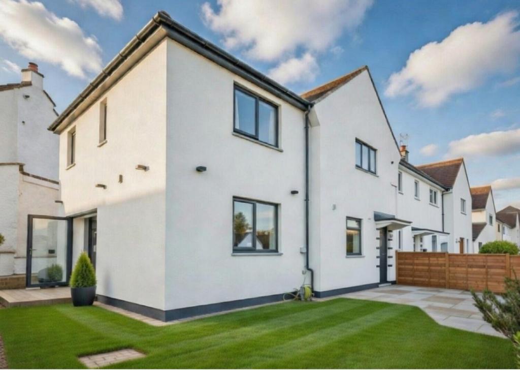 an image of a white house at Dreghorn House 5 b-rooms 9 beds 3 toilets 2 showers,1 bath 2 receiption Secure free Parking 233 Wifi in Edinburgh