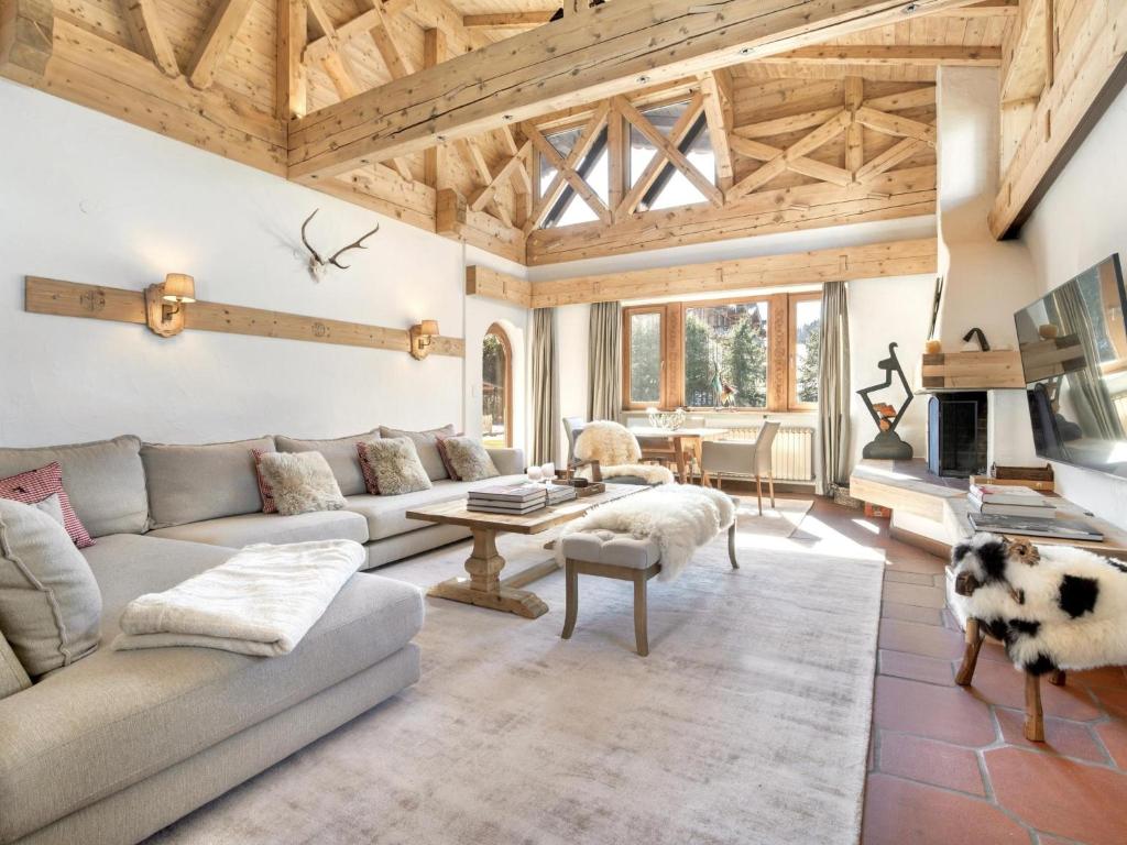 a living room with a couch and a table at Luxury Central Kirchberg in Kirchberg in Tirol