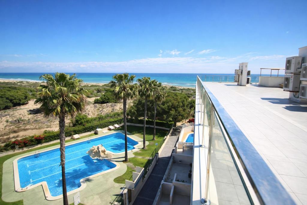 a view of the ocean from the balcony of a resort at AL045 Pinada Beach III La Mata in La Mata