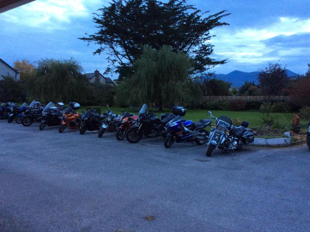 a row of motorcycles parked in a parking lot at The Gardens guest accommodation in Killarney