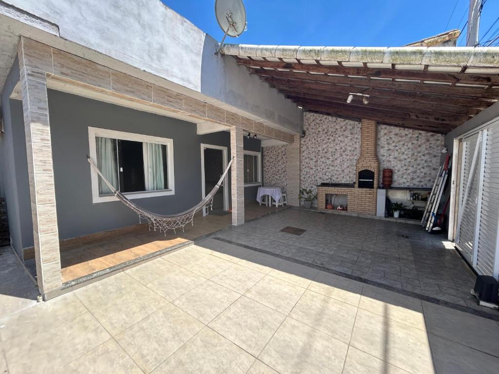 a patio of a house with a porch at Búzios Family House in Búzios