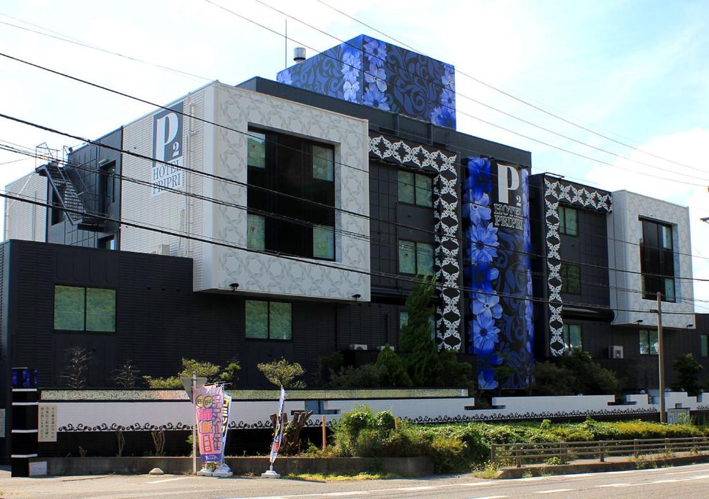 a building with a painting on the side of it at PrincessPrincessAzumino in Azumino