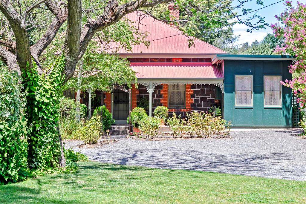 a brick house with a red roof at Winery Cottage in Tanunda