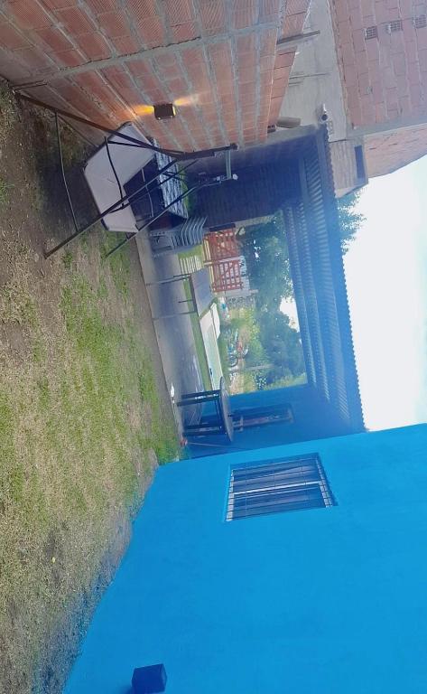 an overhead view of the inside of a building with a blue floor at Cande in Parana