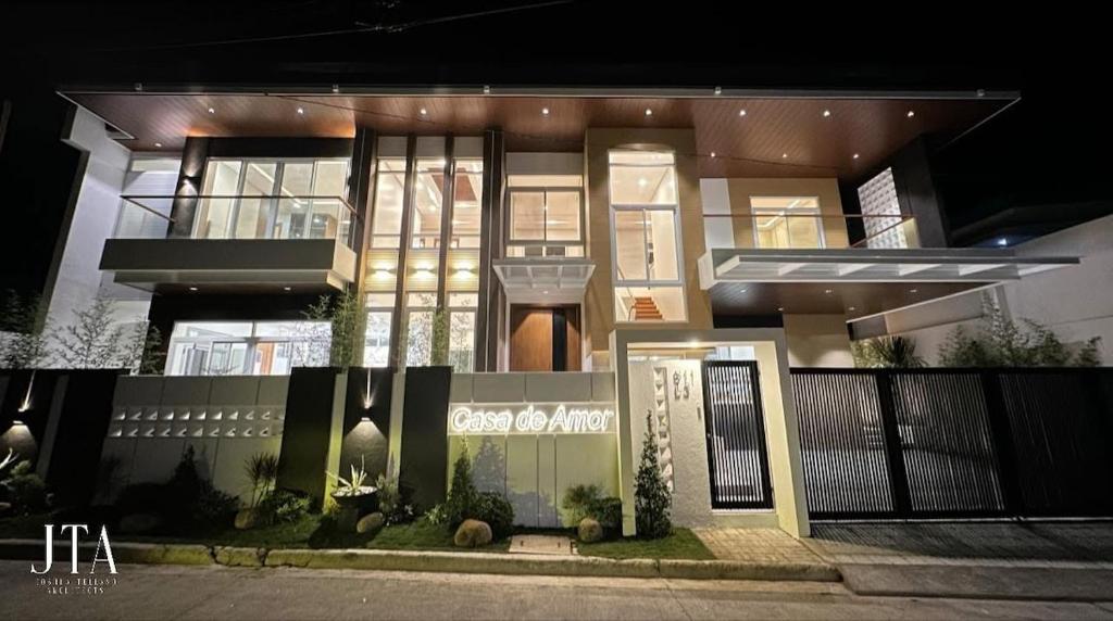 a large house is lit up at night at Luxury House with Private Pool for Gathering in Davao City