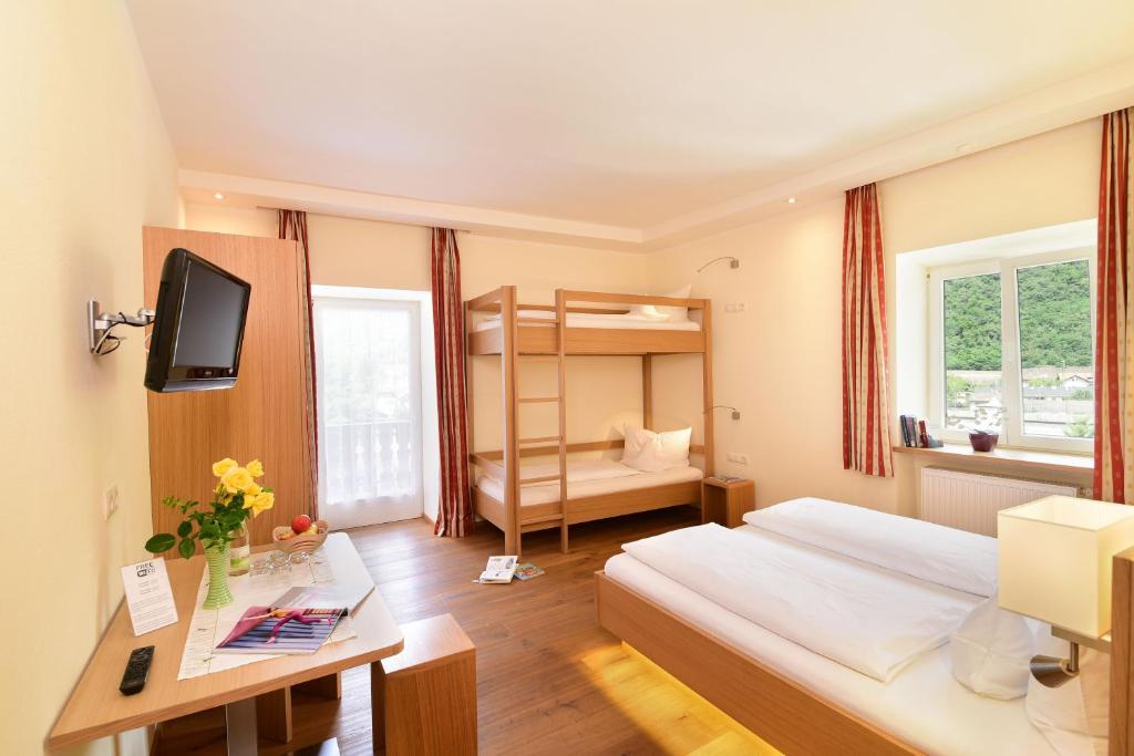 Postel nebo postele na pokoji v ubytování Hotel Ansitz Gamp