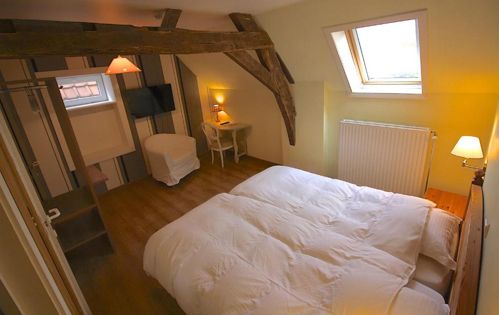 Tempat tidur dalam kamar di Horenbecca Bistro & Wellness