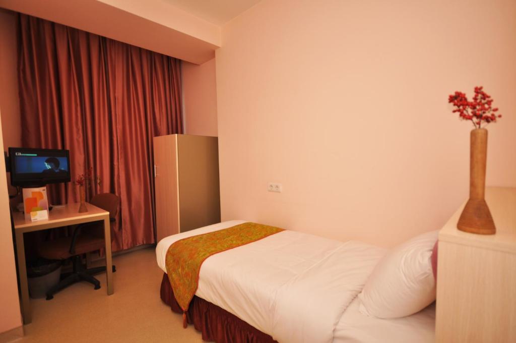 Postel nebo postele na pokoji v ubytování Han Hotel