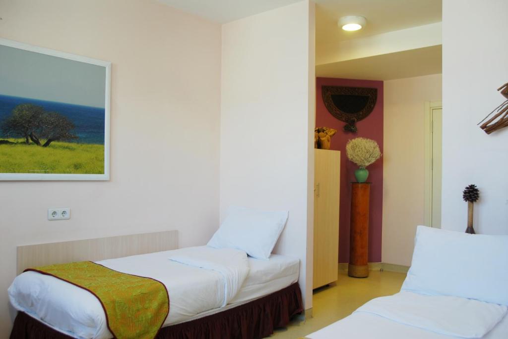 Postel nebo postele na pokoji v ubytování Han Hotel