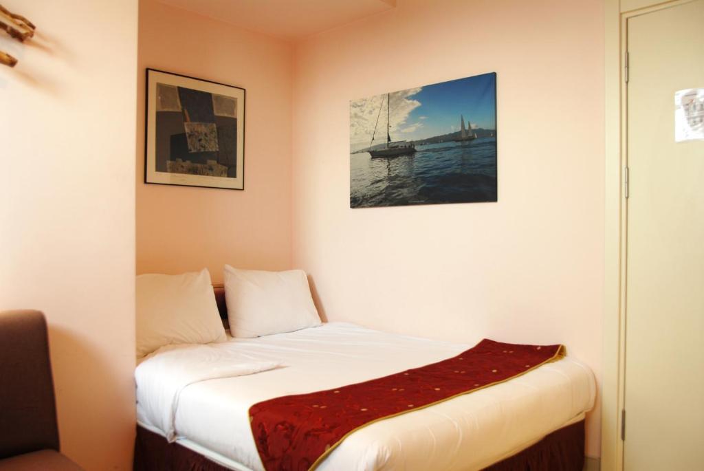 Postel nebo postele na pokoji v ubytování Han Hotel