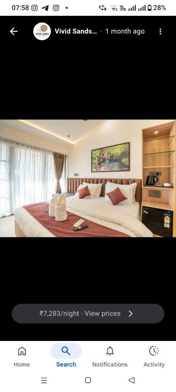 a picture of a hotel room with a bed at Vivid sand beach resort in Revadanda