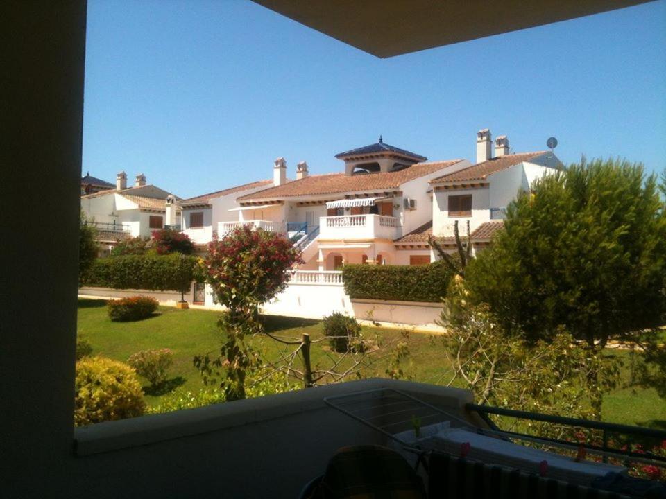 a view of a large house from a balcony at Rosie Apartment in Campoamor