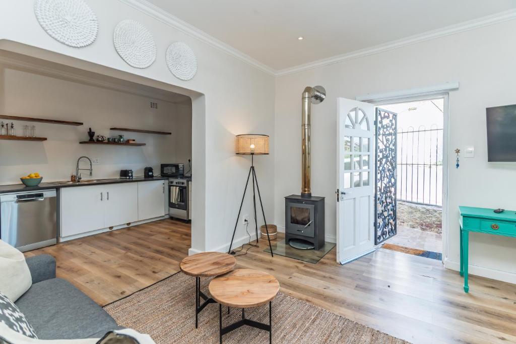 a living room with a couch and a table at 2 on Hope in Simonʼs Town