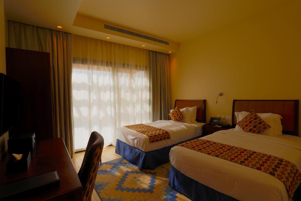 Postel nebo postele na pokoji v ubytování Royal L'azure Resort